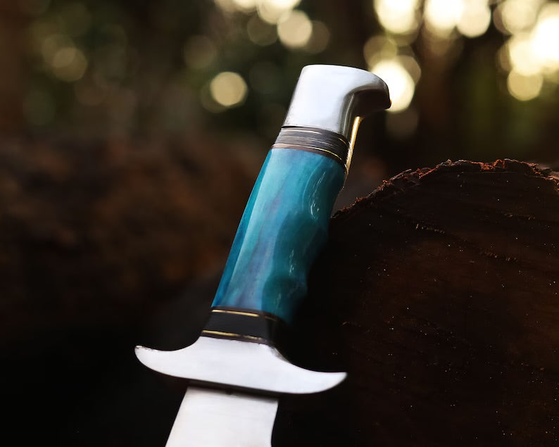 13-inch J2 steel Bowie knife featuring a vibrant bone handle, steel guard for hand protection, and a leather sheath for secure storage.