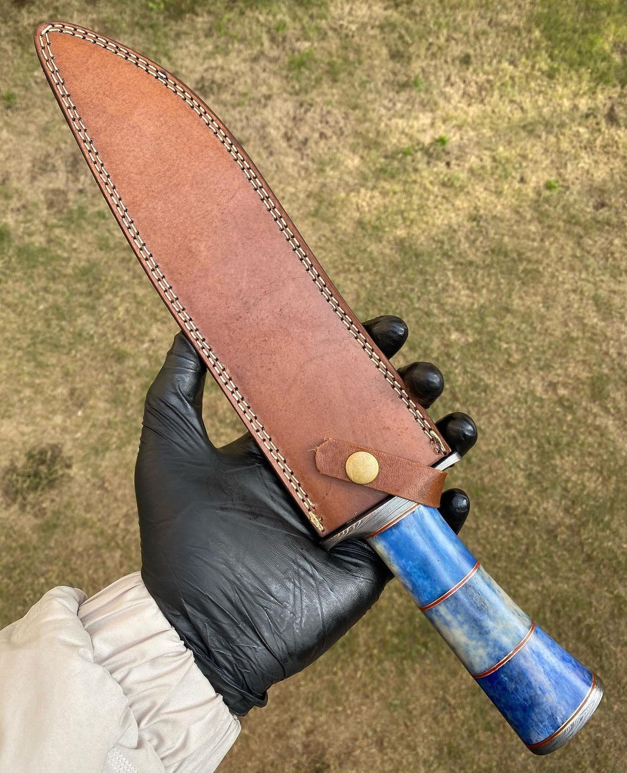 15-inch Damascus steel Bowie knife featuring a vibrant colored bone handle and durable steel guard