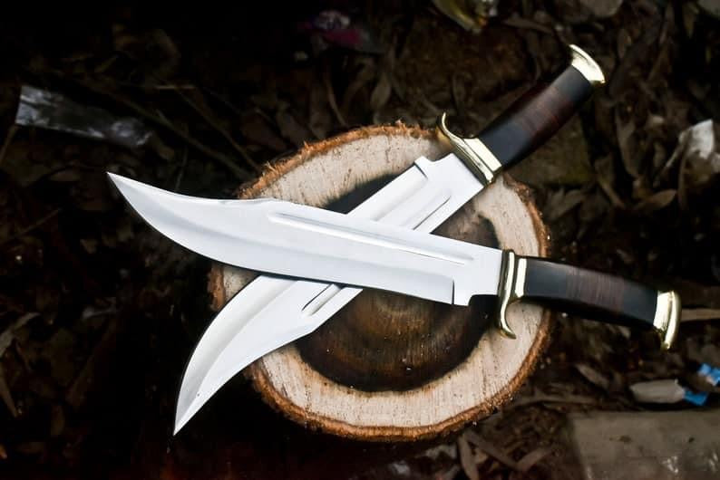 16-inch Crocodile Dundee Bowie knife by Paul Hogan with a 440C steel blade, leather and buffalo horn handle, elegant brass guard, and a beautiful leather sheath