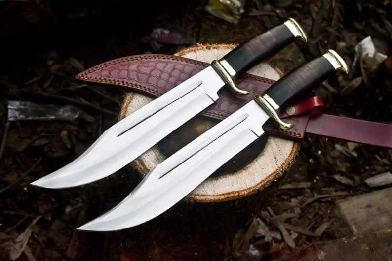 Crocodile Dundee Bowie Knife with brass guard and buffalo horn handle, featuring a leather sheath