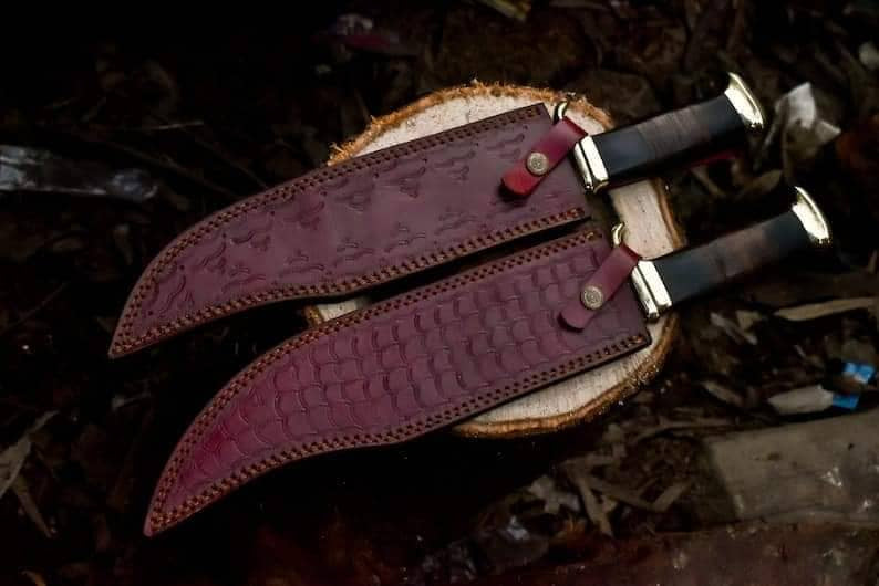 Crocodile Dundee Bowie Knife with brass guard and buffalo horn handle, featuring a leather sheath