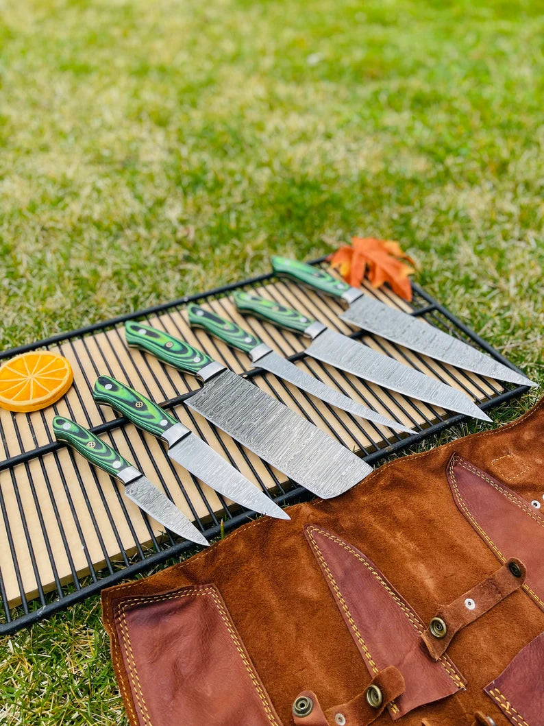Handmade Damascus kitchen knife set with leather roll kit and G10 handles for professional chefs