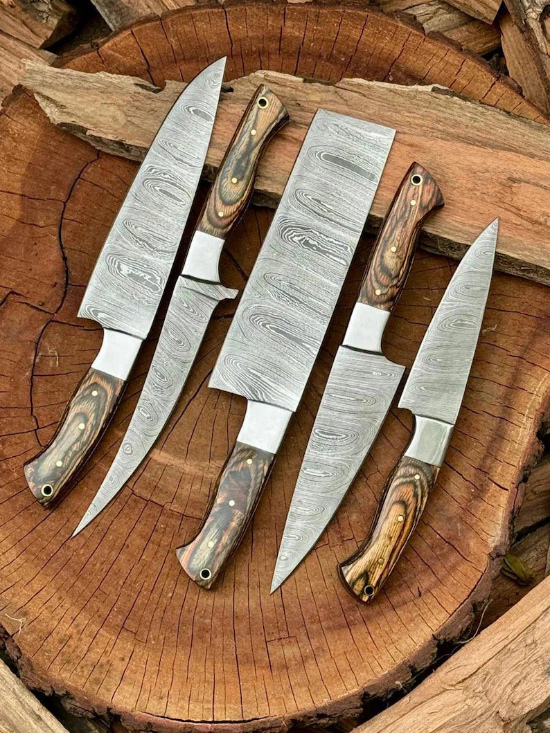 Close-up of custom handmade Damascus steel knife set with pakkawood handles and hand-forged blades in various lengths