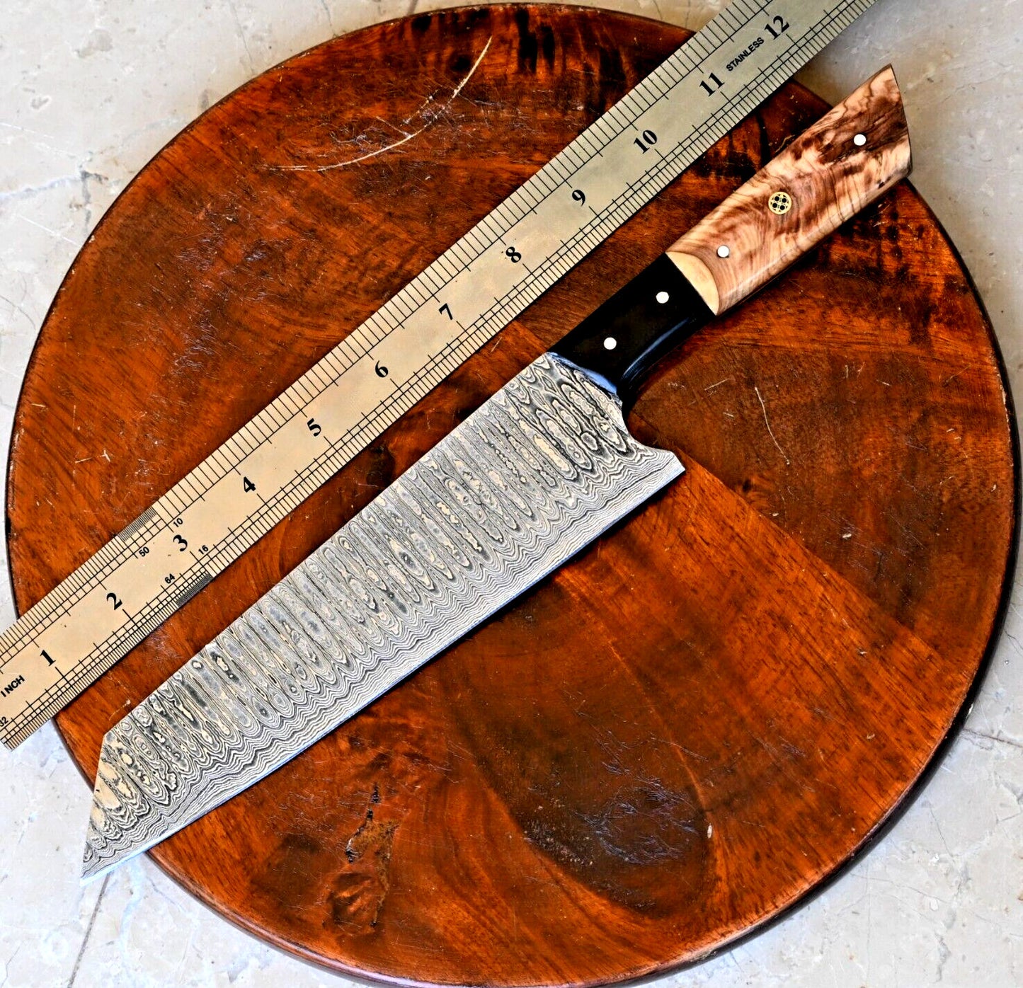 Custom Damascus chef knife with 7-inch blade and unique olive wood-resin handle, ideal for chefs seeking quality and style