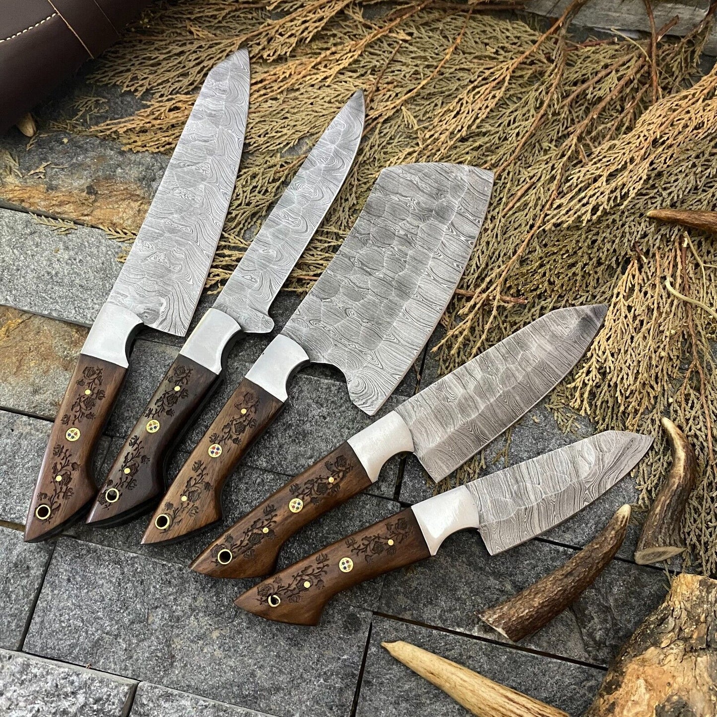 "Custom Damascus knife set with hand-forged steel blades and rosewood handles, ranging from 9” to 13” in length