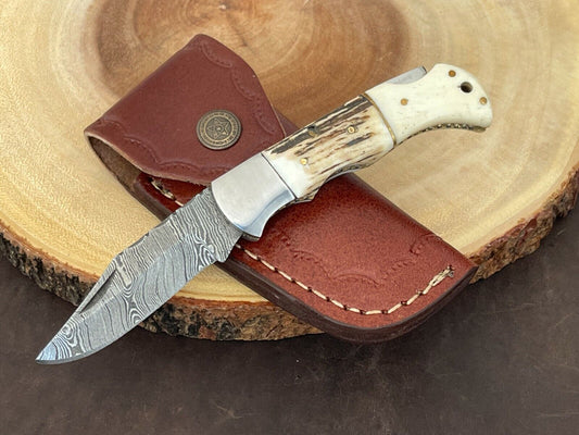 Custom Damascus steel pocket knife with stag and camel bone handle and steel bolster