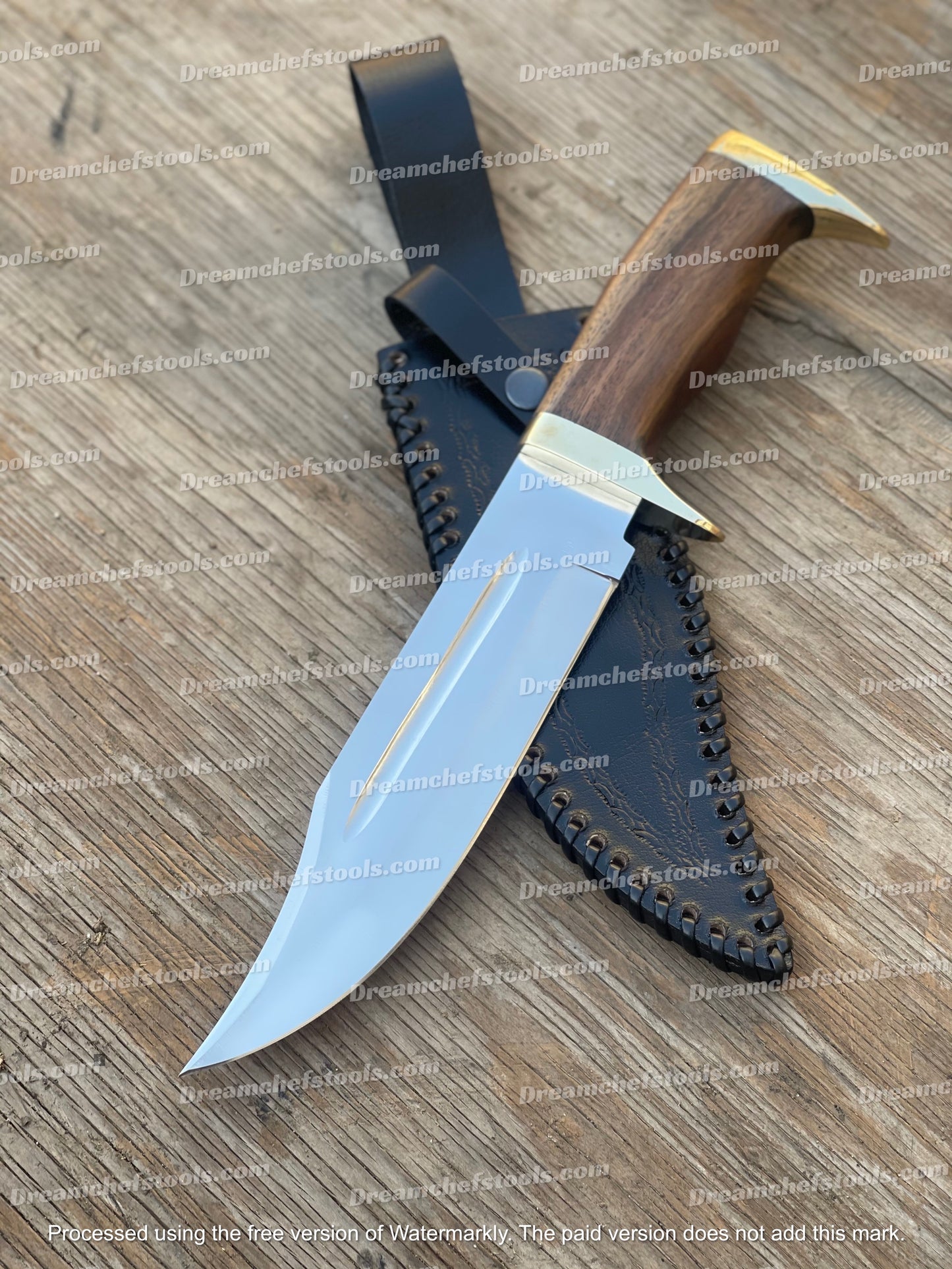 Custom handmade 13-inch D2 steel hunting Bowie knife with an olive wood handle, brass guard, and a handcrafted leather sheath