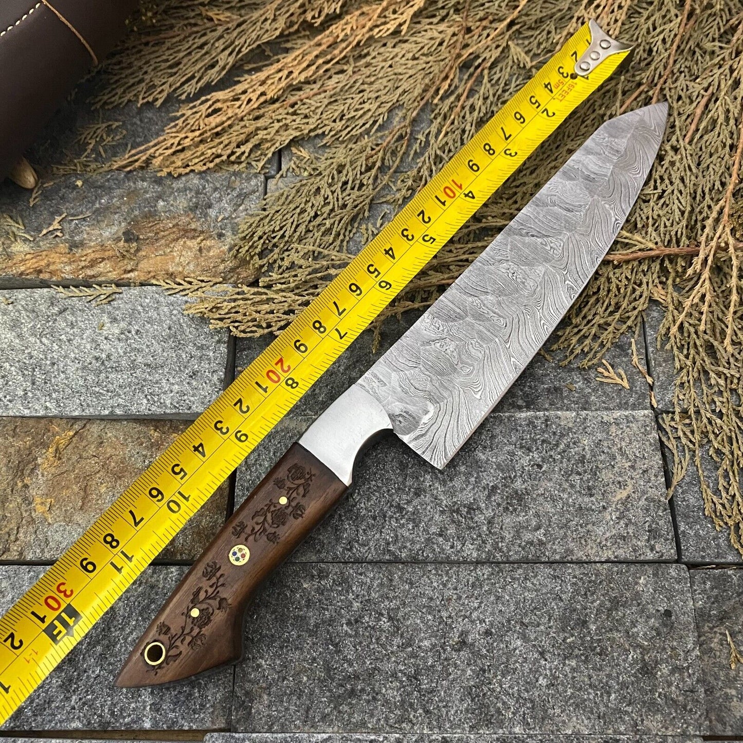 Custom handmade Damascus chef knife with a 7-inch hand-forged Damascus steel blade, engraved rosewood handle, and steel bolster – premium quality kitchen knife for precision cutting