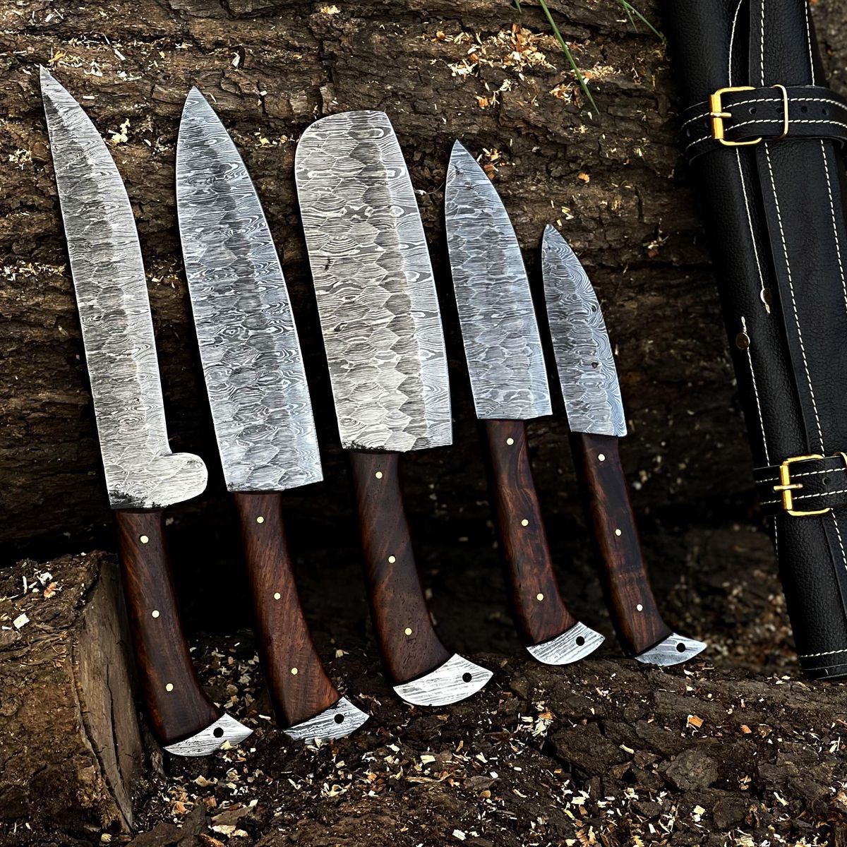 Custom handmade Damascus knife set with rosewood handles, featuring hand-forged blades ranging from 4 to 8 inches, displayed elegantly on a wooden block