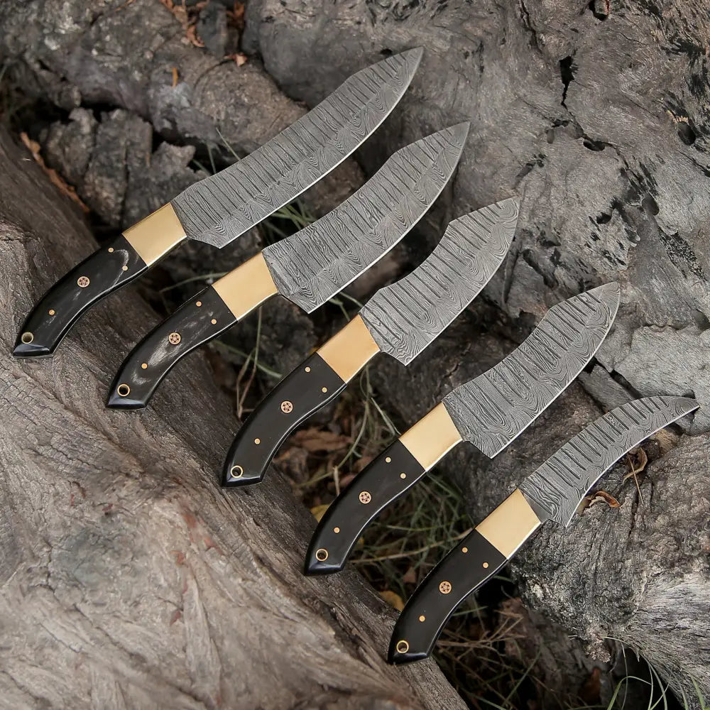 "Custom handmade Damascus steel kitchen knife set featuring buffalo horn handles and brass bolsters, showcasing blades ranging from 9 to 13 inches