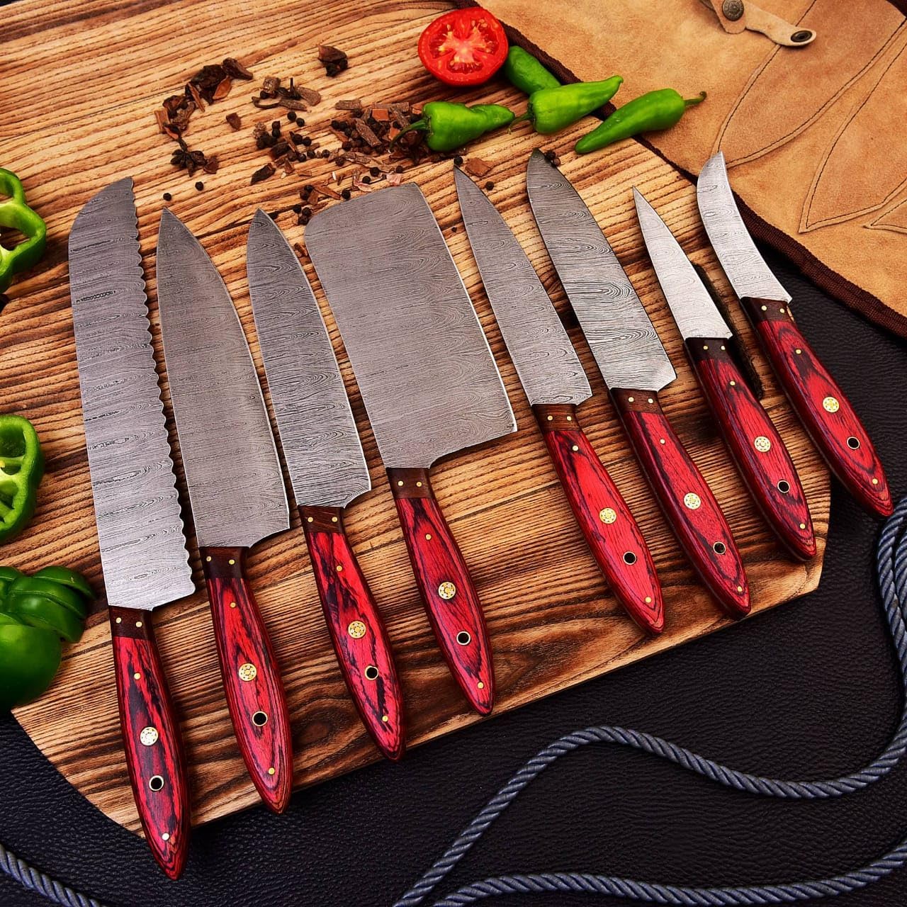 Custom handmade Damascus steel kitchen knives set with 3 to 8-inch blades, featuring pakkawood and rosewood handles