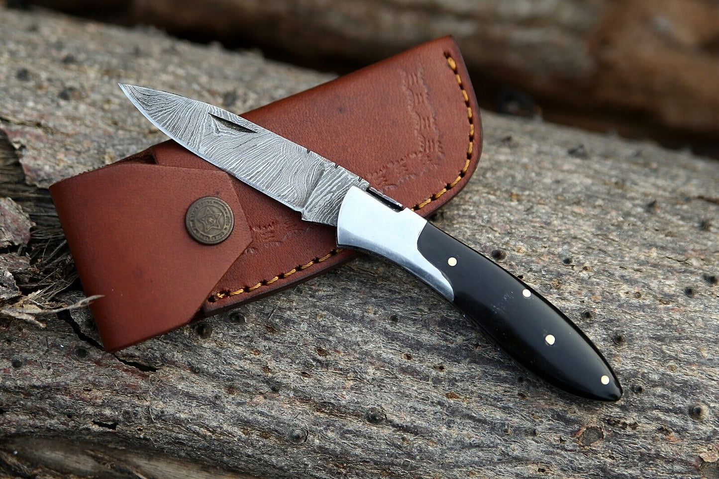 Custom handmade Damascus steel pocket knife with buffalo horn handle and steel bolster"