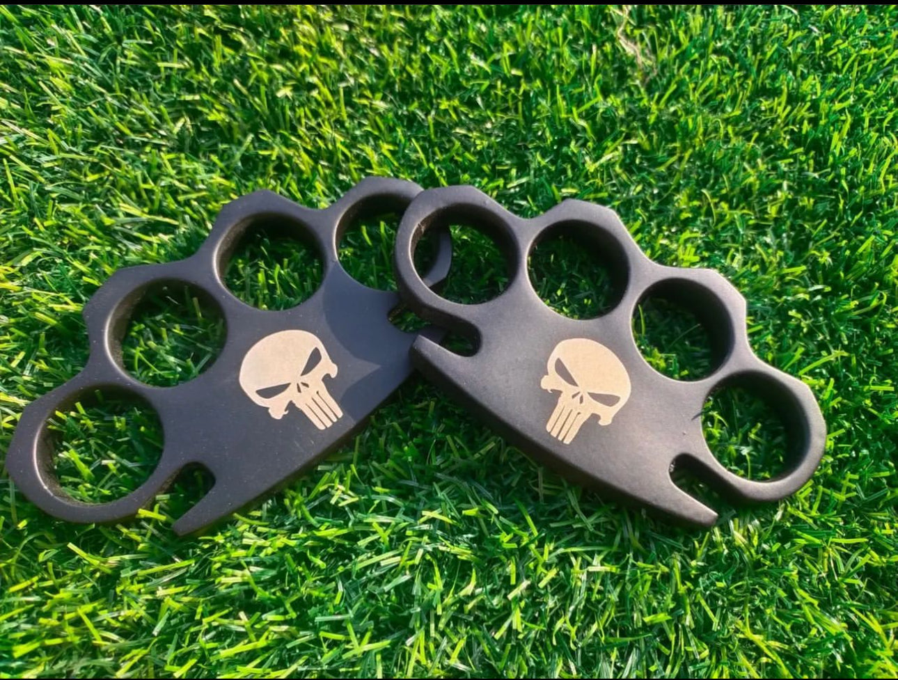 Custom handmade black steel engraved knuckle duster with a solid brass core and leather case for self-defense