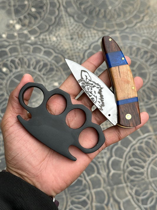 Custom handmade black steel knuckle with integrated pocket knife and belt loop leather case