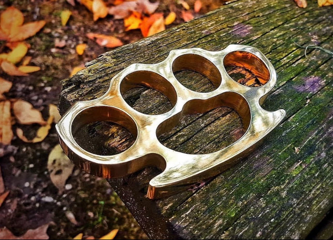 Custom handmade brass knuckle with a belt loop leather case, ideal for self-defense and everyday carry