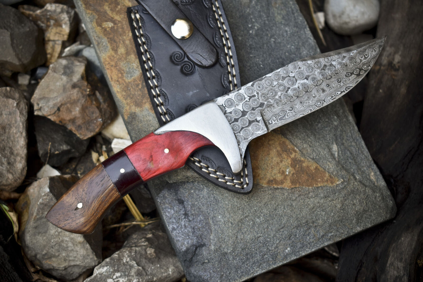 Damascus hunting knife with pakkawood and rosewood handle, handmade for outdoor use, with leather sheath
