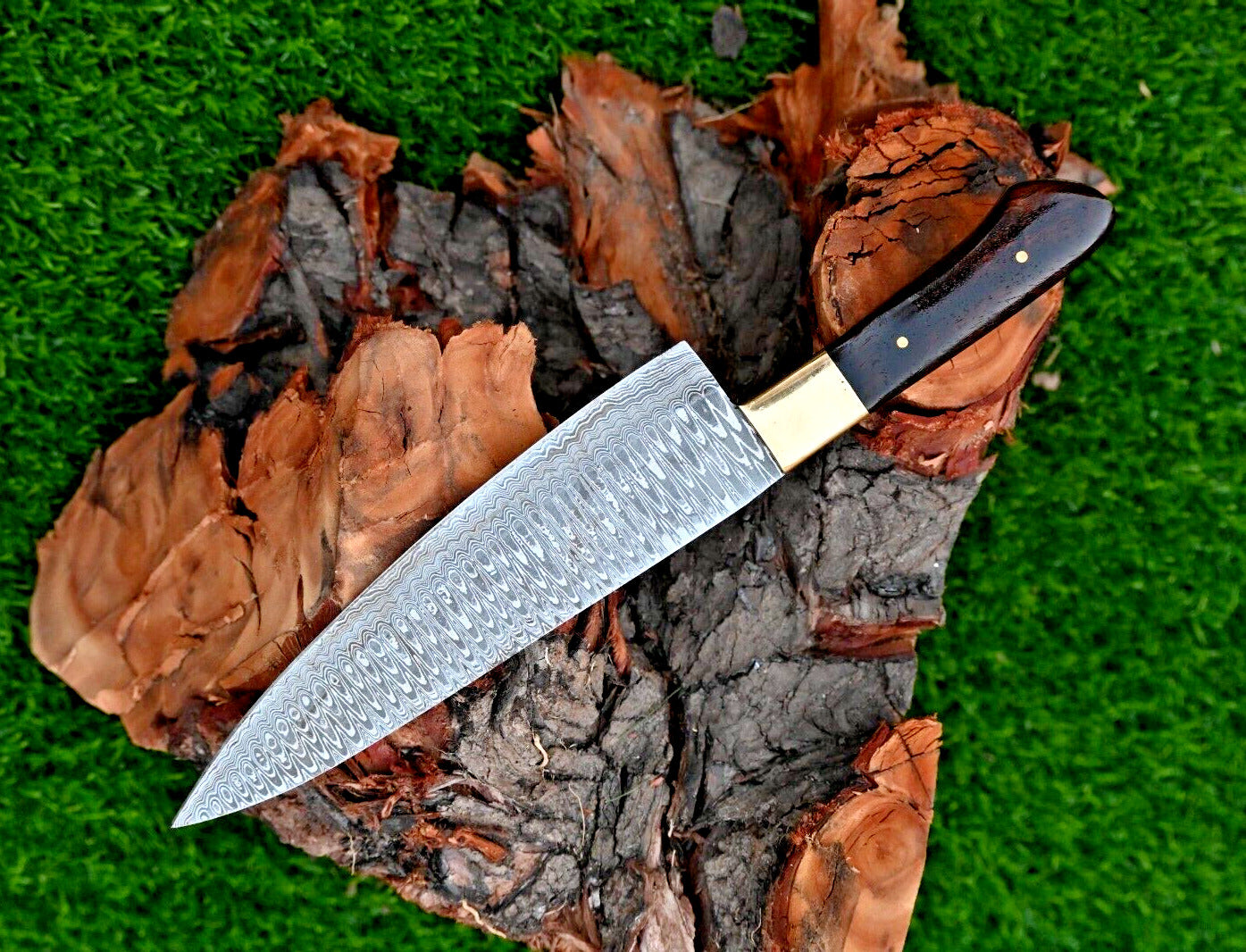 "Damascus steel chef knife with rosewood handle and leather sheath