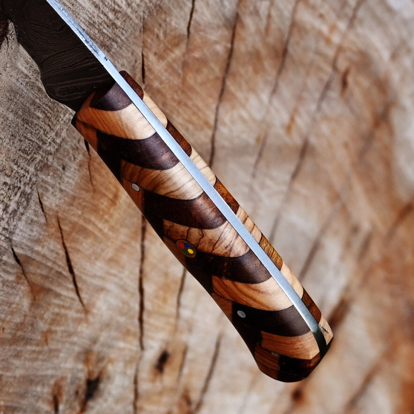 Custom handmade Damascus steel fillet knife with a combination rosewood and olive wood handle, complete with a leather sheath, ideal for anglers.