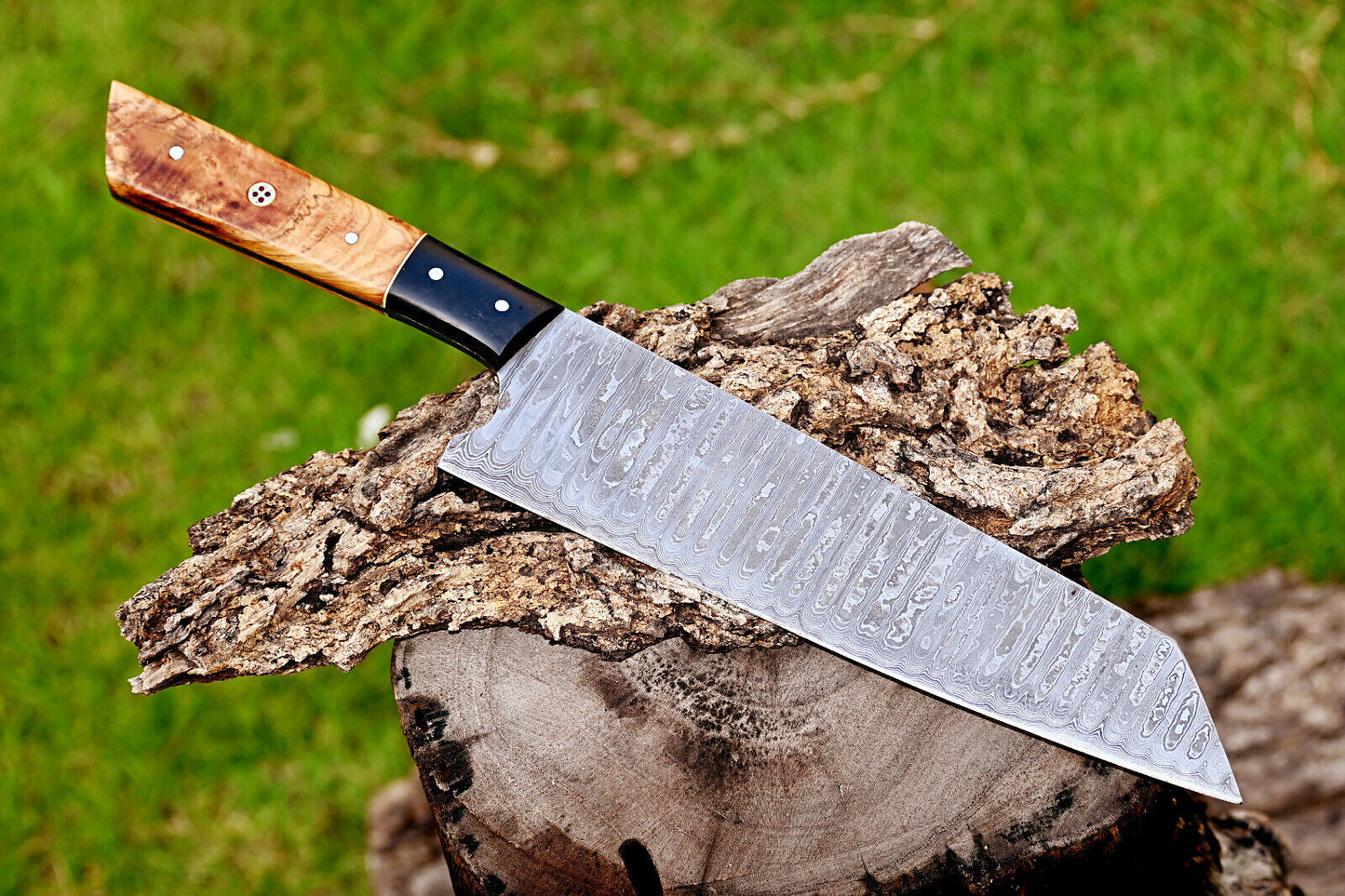 Elegant 7-inch Damascus steel chef knife with handcrafted olive wood and resin handle, perfect for professional and home kitchen use."