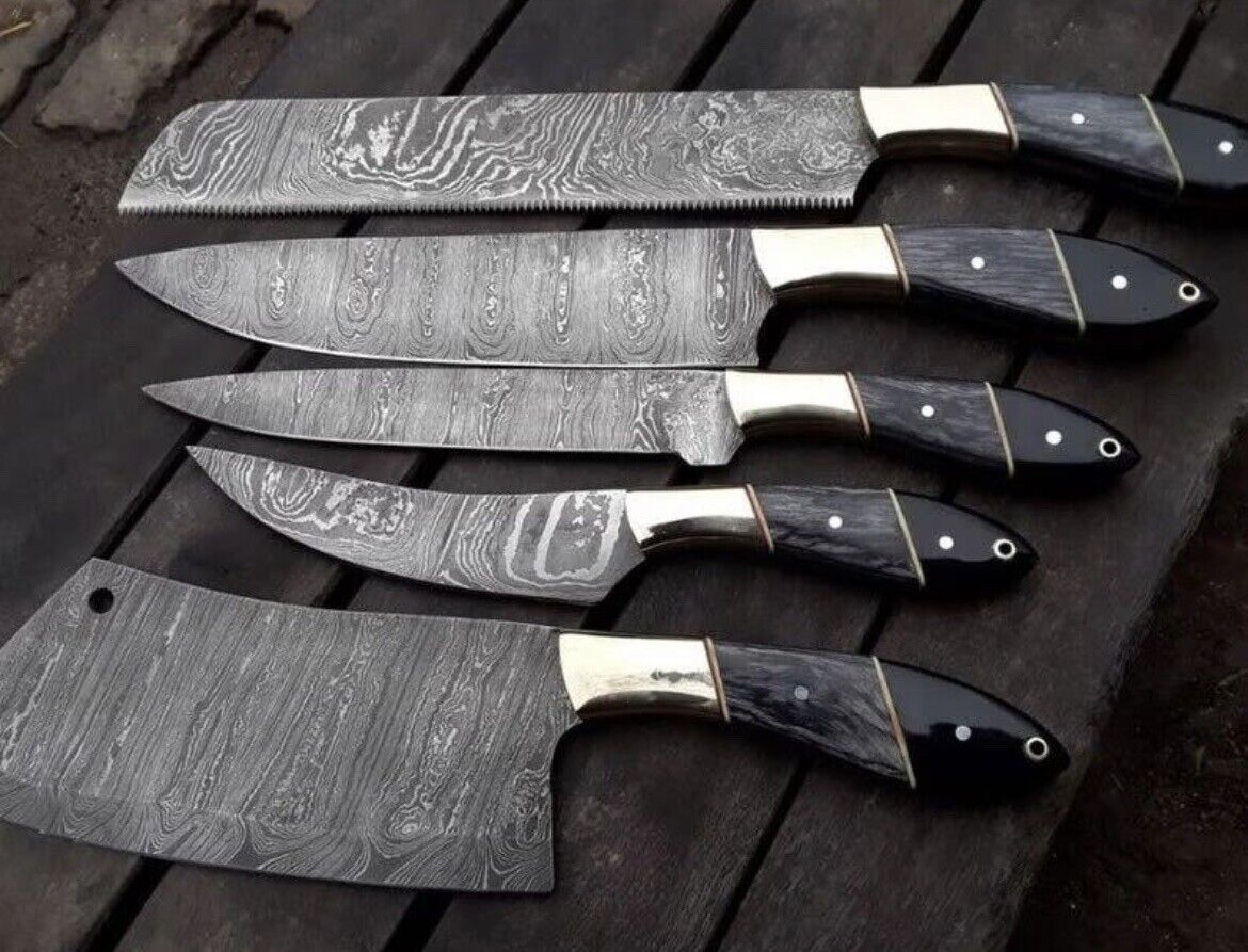 Elegant Damascus steel kitchen knives set featuring steel bolster, pakkawood, and buffalo horn handles, complete with leather sheath.