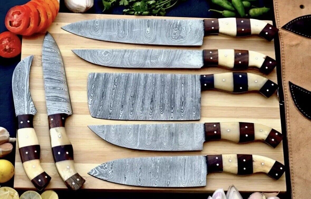 Elegant custom handmade Damascus chef knife set, showcasing hand-forged blades ranging from 9 to 13 inches with beautiful rosewood and olive wood handles