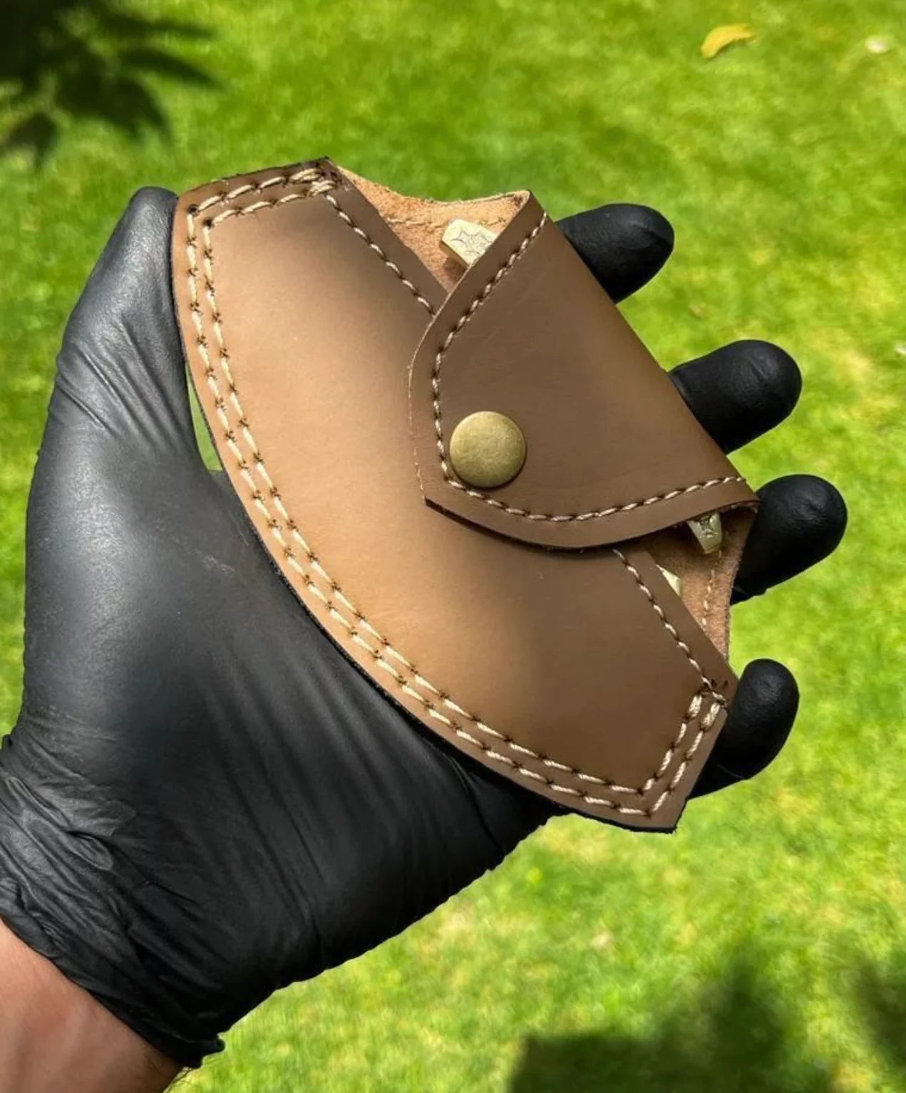 Engraved brass knuckles with high-quality leather case for secure carry