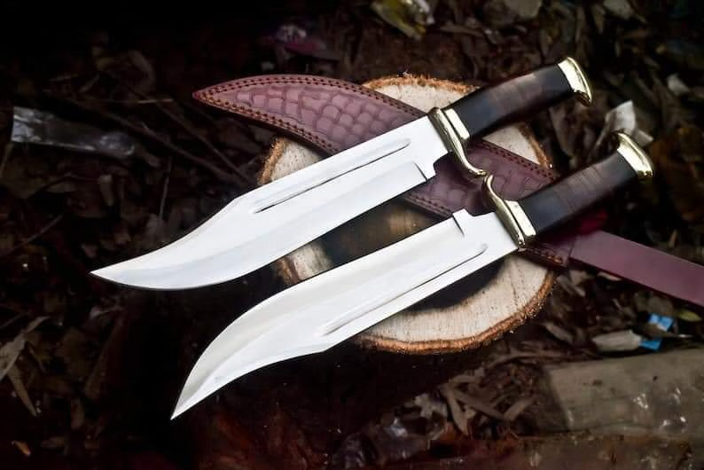 Crocodile Dundee Bowie Knife with brass guard and buffalo horn handle, featuring a leather sheath