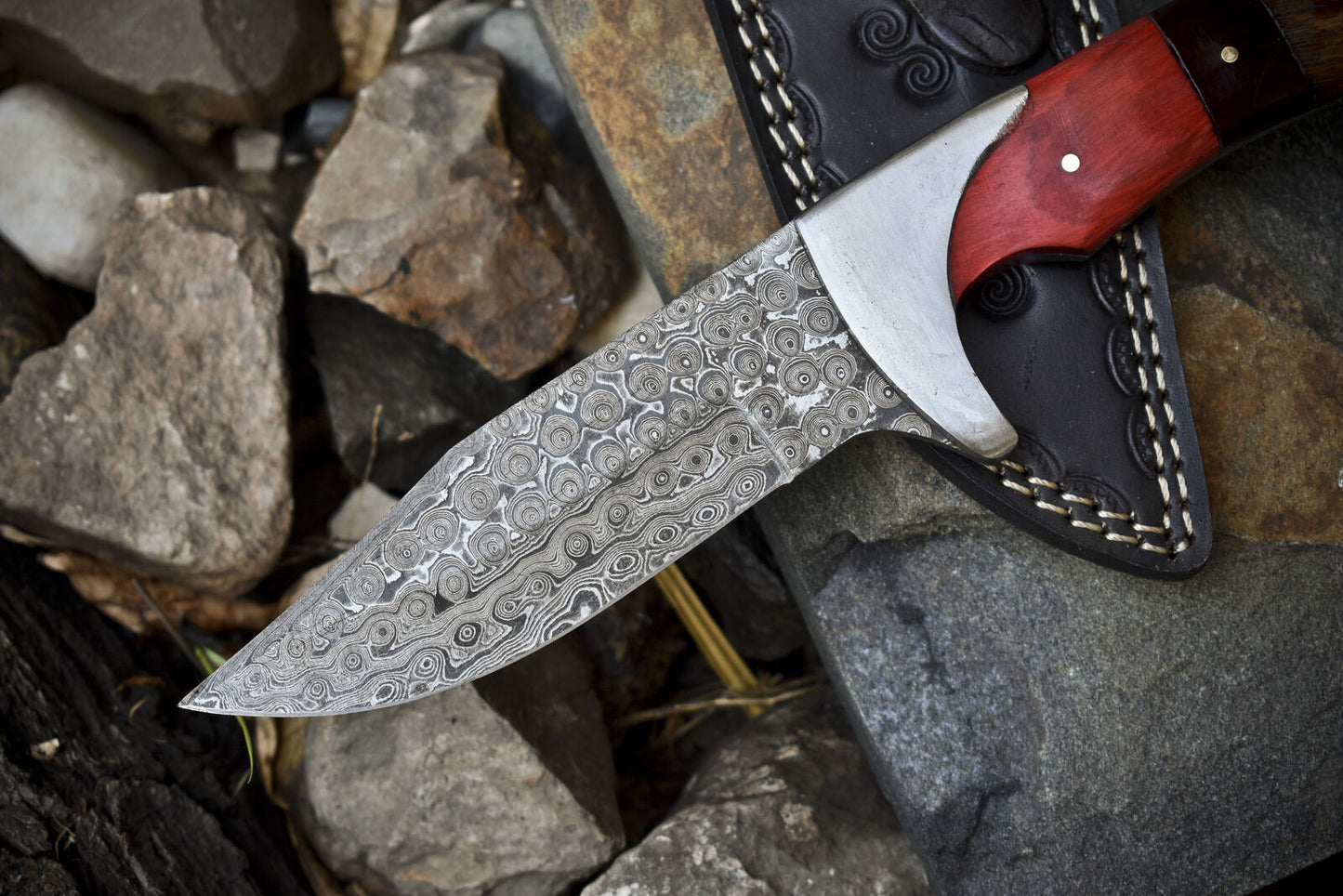Handcrafted Damascus steel hunting knife with pakkawood and rosewood handle and steel bolster.