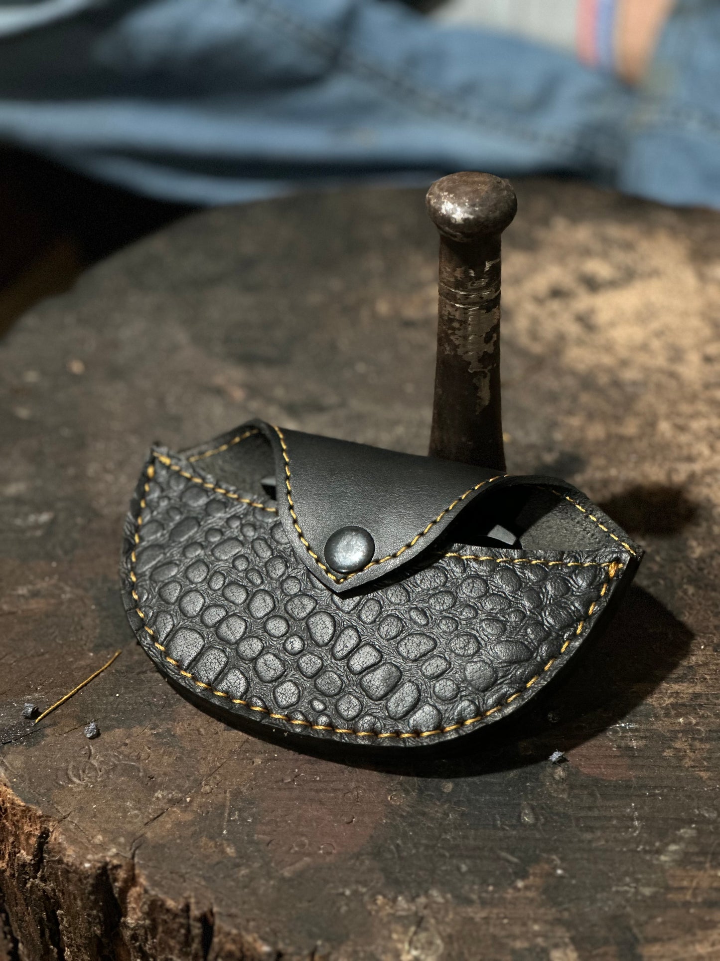 Handcrafted black steel knuckle with custom engraving and premium leather case