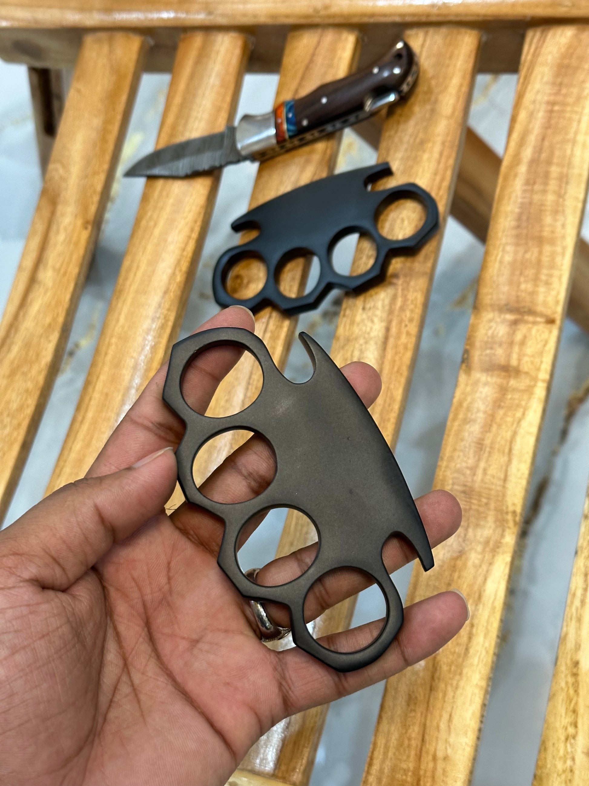 Handcrafted black steel knuckle with pocket knife and premium leather case for everyday carry