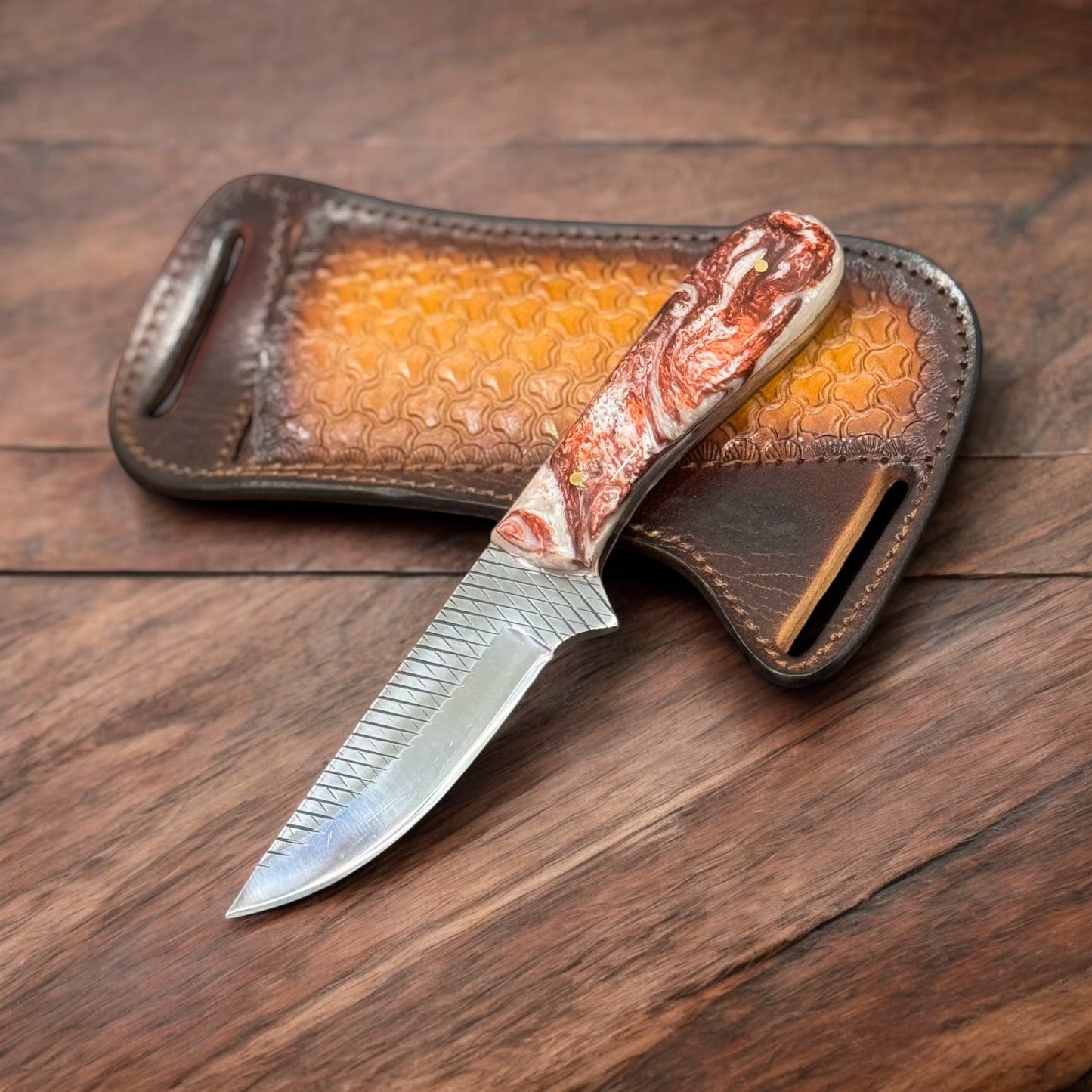"Handcrafted country knife with leather belt sheath, rasp tool blade, and resin handle"