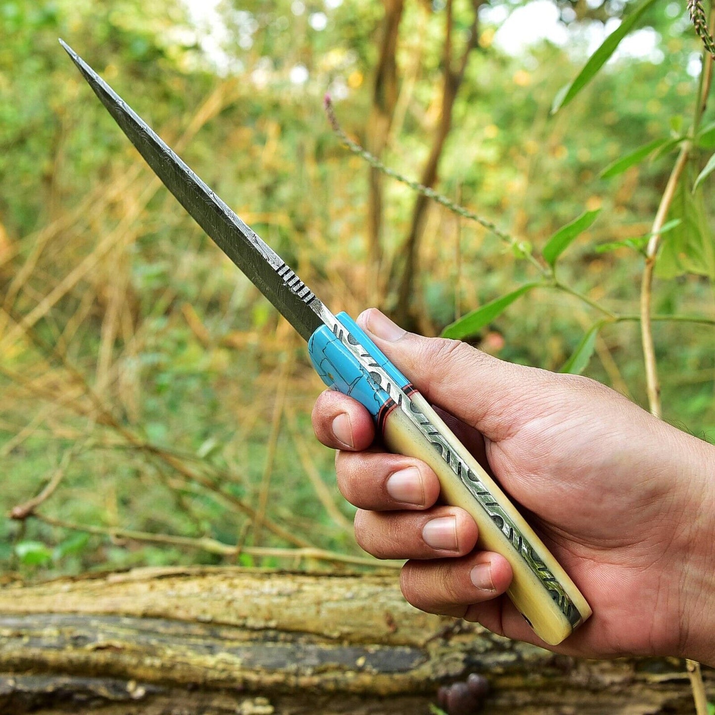 "Handmade 10-inch Damascus steel hunting knife featuring a camel bone and resin handle"