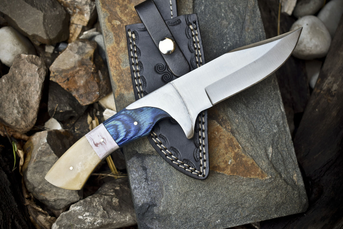 J2 steel hunting knife with pakkawood and camel bone handle, handcrafted for outdoor use.