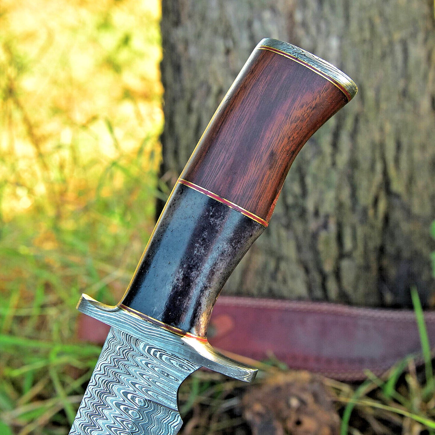 Leather sheath paired with a custom 16-inch Damascus steel Bowie knife