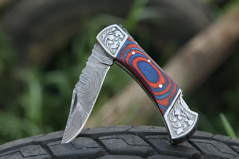 Custom Handmade Damascus Utility Folding Pocket Knife – 7” with Pakkawood Handle & Engraved Bolster | Leather Sheath
