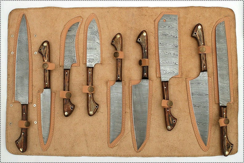 Custom handmade Damascus knife set with pakkawood and olivewood handles.
