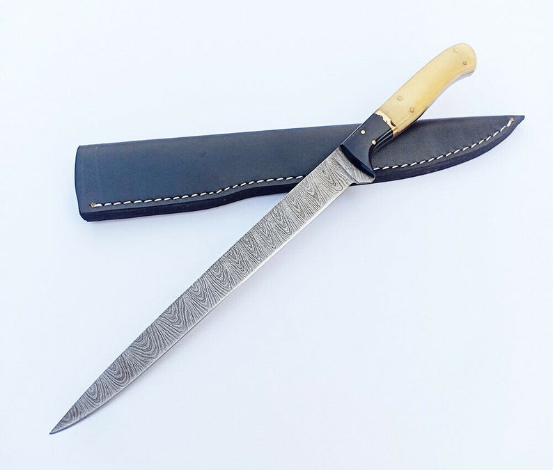 Custom handmade Damascus steel fishing fillet knife with a 13-inch blade, bone and buffalo horn handle, sharp edge, and leather sheath