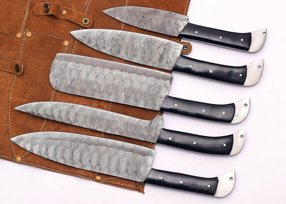 Custom handmade Damascus steel knife sets featuring 9" to 13" hand-forged blades and resin handles, showcasing craftsmanship and quality
