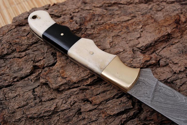 Damascus Steel Fillet Knife with 13-Inch Blade and Ergonomic Handle.