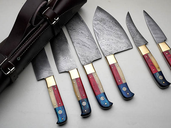 Damascus steel kitchen knife set with a mix of camel bone and pakkawood handles, designed for versatile cutting tasks