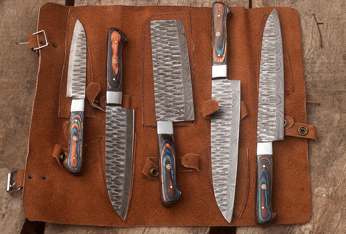 Elegant Damascus Steel Knives Set Showcasing Unique Blade Patterns and Premium Handles
