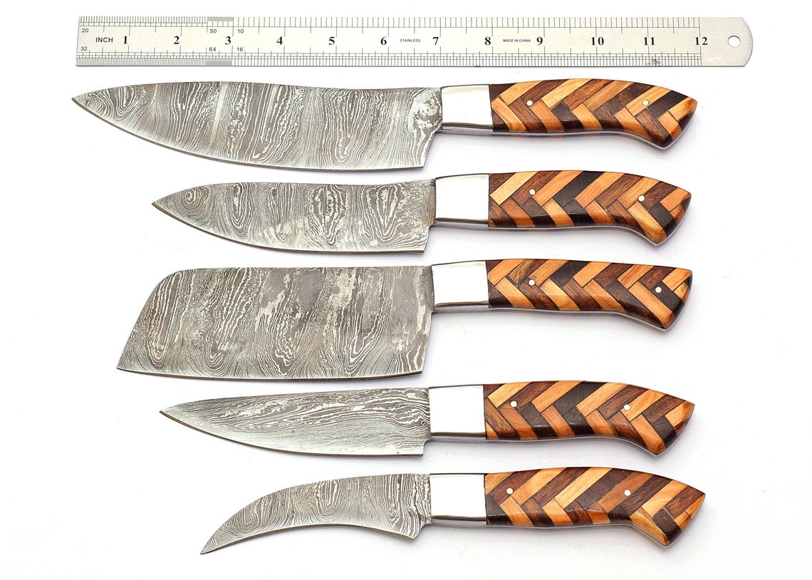 Handcrafted Damascus chef knives with pakkawood and olivewood handles, designed for versatile kitchen use