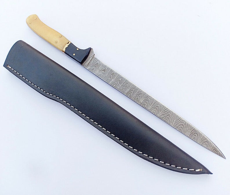 handmade Damascus steel fishing fillet knife with a 13-inch blade, bone and buffalo horn handle, sharp edge, and leather sheath