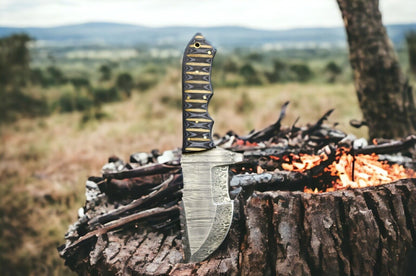 10-inch forged Damascus steel hunting tracker knife with ergonomic full tang handle.