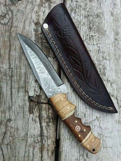 inches Damacus steel fixed blade hunting knife. Rose wood and olive wood handle.