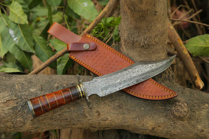 Custom handmade Damascus steel Bowie knife with a Damascus steel guard, rosewood, and brass handle, including a leather sheath.