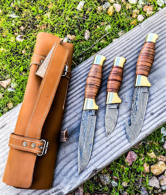 Wilderness Trio: 3-Piece Hunting Knives Set with Damascus Steel Blades, Stacked Leather Handles, Brass Guards, and Leather Roll