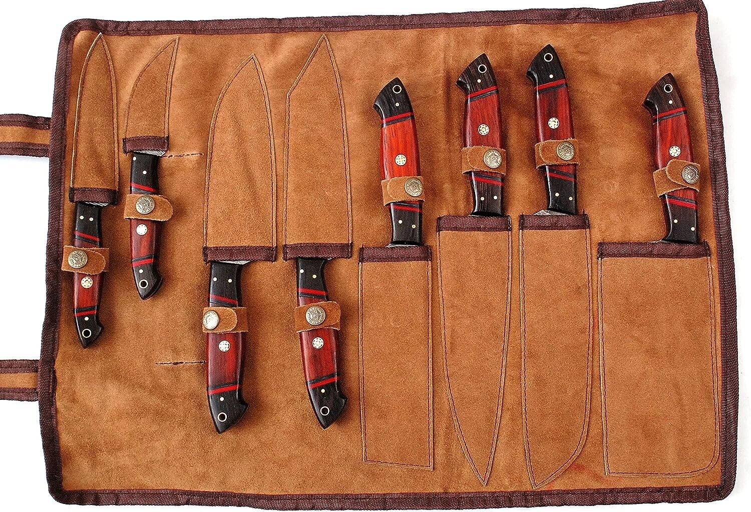 Close-up of Damascus steel knife set showing intricate blade patterns and ergonomic handle design
