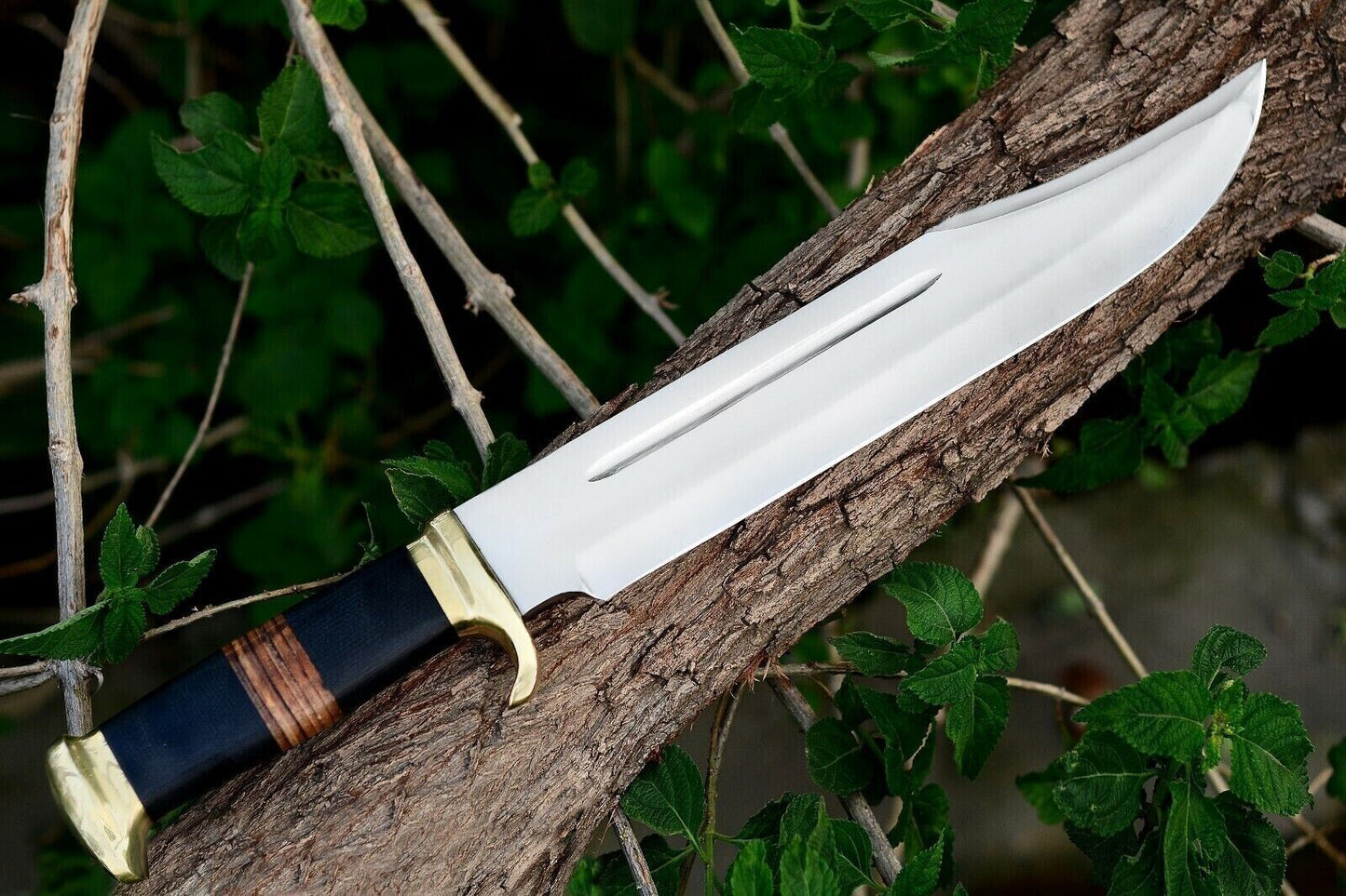 Crocodile Dundee-inspired Bowie knife with buffalo horn and leather grip, 16 inches.