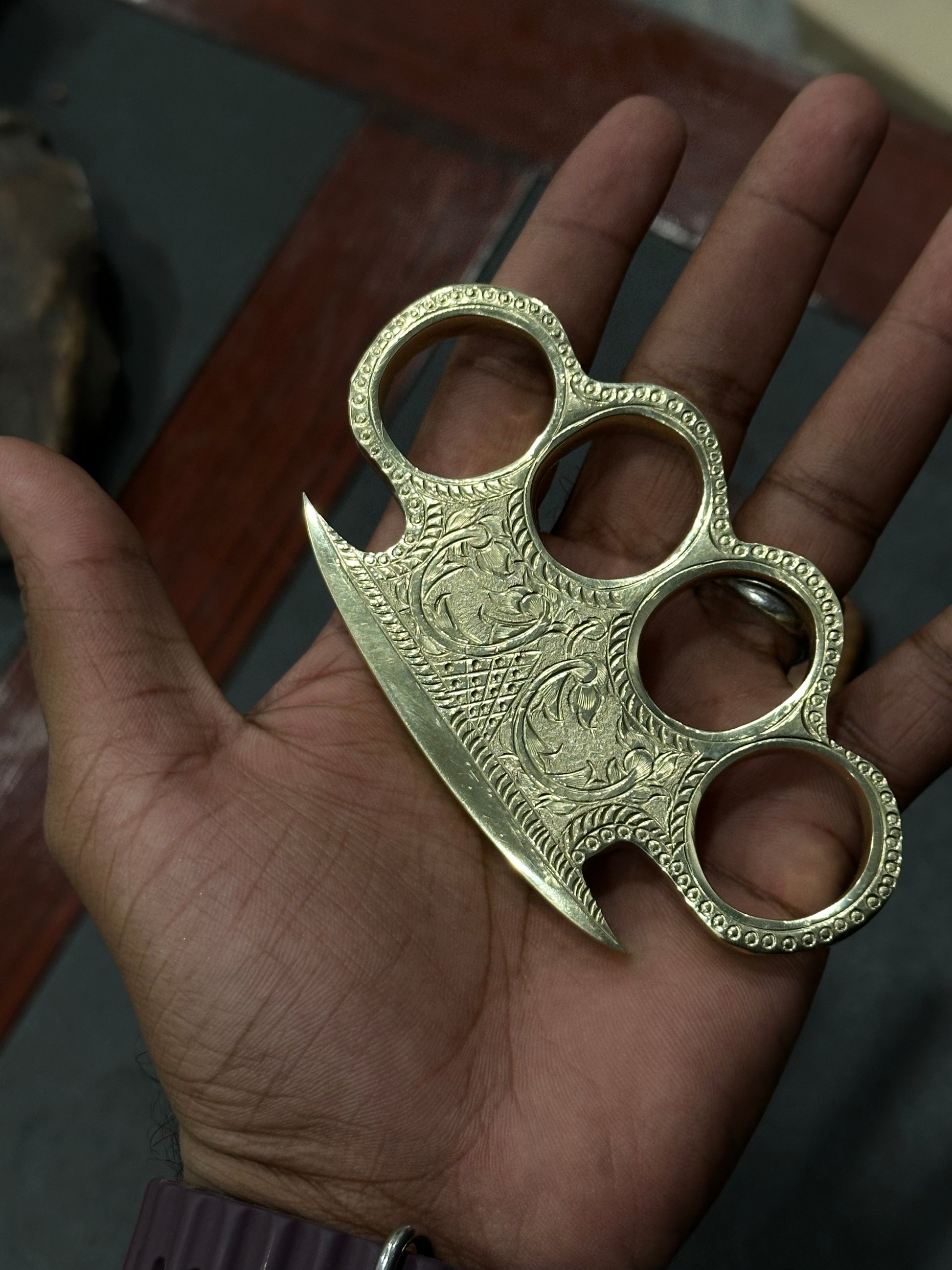 Custom Engraved Brass Knuckles on a Belt